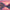 Pixelated landscape of mountains and a lake with a sunset sky.